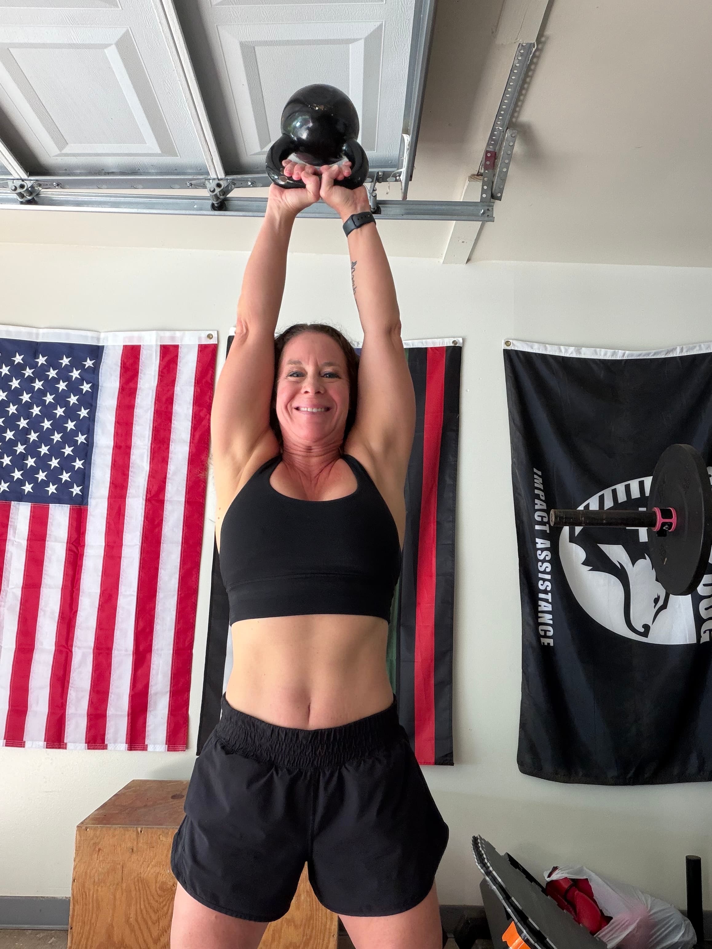 Angie lifting a kettlebell